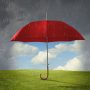 Red umbrella protecting grass from rain